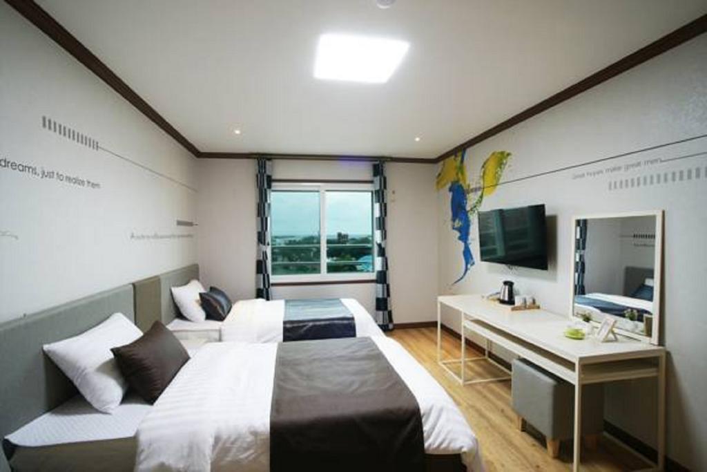 Seongsan Aqua Beach Hotel Seogwipo Ruang foto